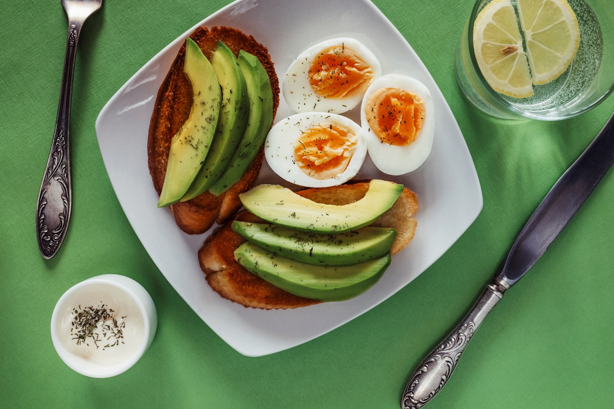 Heart-healthy foods including fish, olive oil, and leafy greens